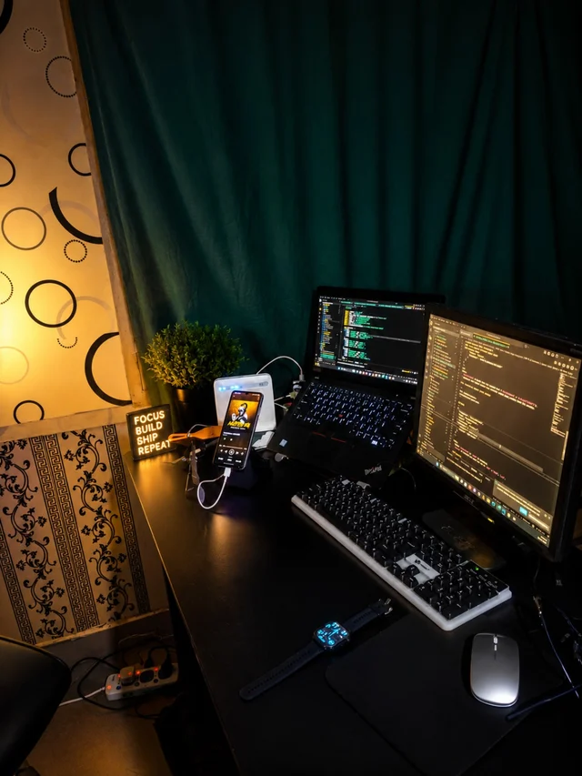 Benedict’s desk with a computer and creative tools